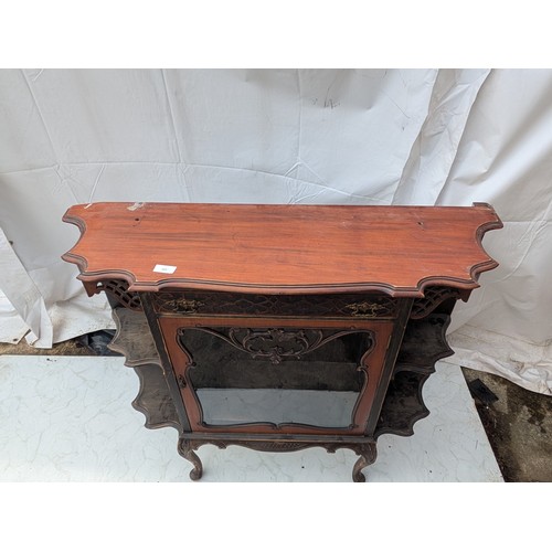 460 - A stylish Victorian mahogany display unit with glass Fronted shelving area and exterior Bevelled she... 