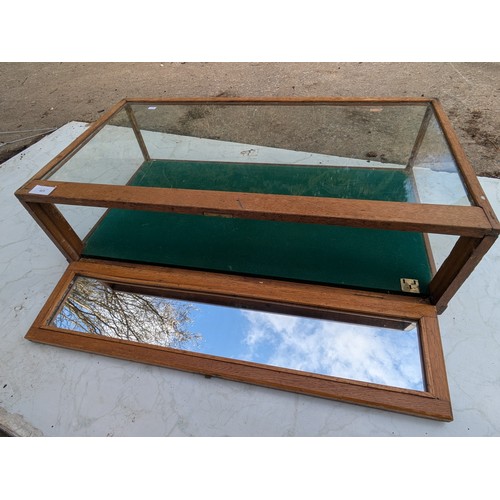 423 - A vintage Oak glass topped display case