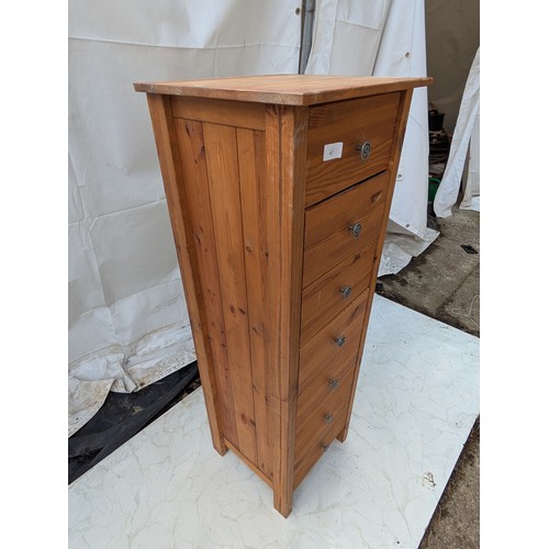 427 - A pine 7 drawer storage unit