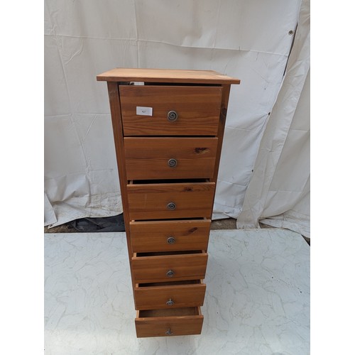 427 - A pine 7 drawer storage unit