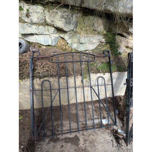 36 - A wrought iron double driveway gate with posts