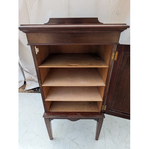 422 - An early 20th century mahogany storage cabinet with interior drawers