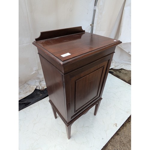 422 - An early 20th century mahogany storage cabinet with interior drawers