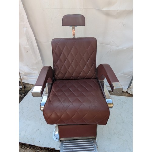 405 - A retro red faux leather and chrome barber's chair - fully adjustable with head rest