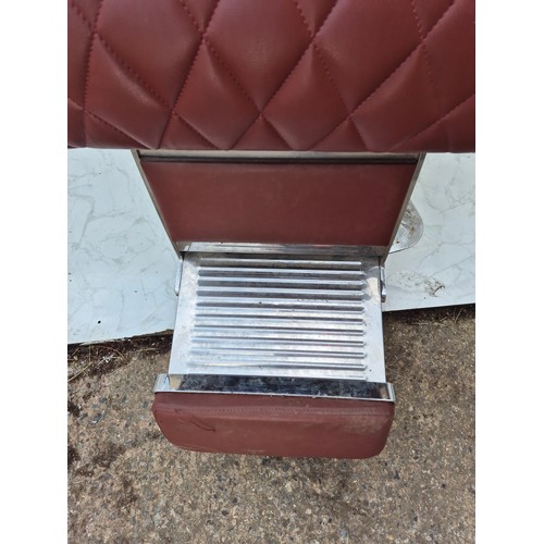 407 - A retro red faux leather and chrome barber's chair - fully adjustable with head rest