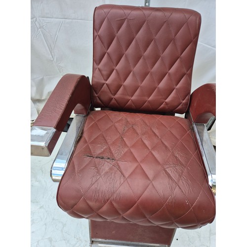 406 - A retro red faux leather and chrome barber's chair - fully adjustable with head rest