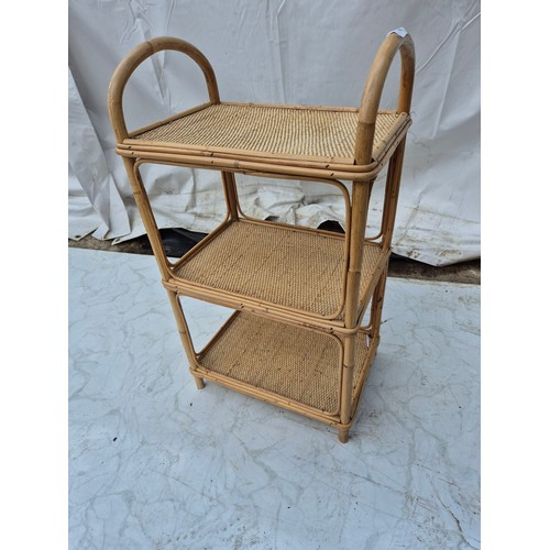 400 - A wicker 3 tier shelving unit