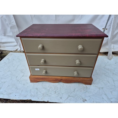 404 - A pine 3 drawer leather topped chest of drawers