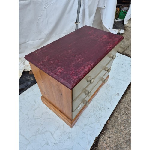 404 - A pine 3 drawer leather topped chest of drawers