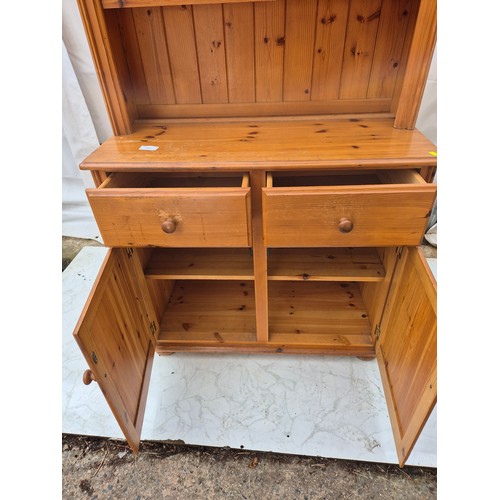 414 - A pine dresser by Yorkshire Pine - 2 drawers and storage space