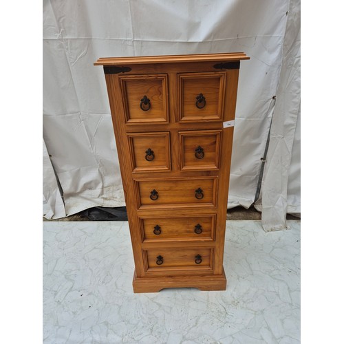 434 - A tall 7 drawer mexicn style pine storage unit