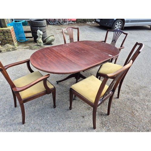 419 - A nice mahogany vernier drop leaf dining table on lions paw castors with 5 dining chairs