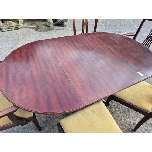 419 - A nice mahogany vernier drop leaf dining table on lions paw castors with 5 dining chairs