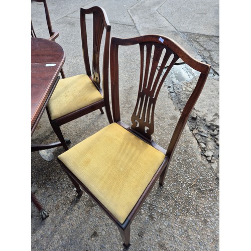 419 - A nice mahogany vernier drop leaf dining table on lions paw castors with 5 dining chairs