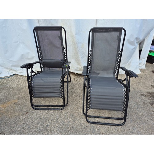 109 - A pair of metal framed collapsible garden chairs