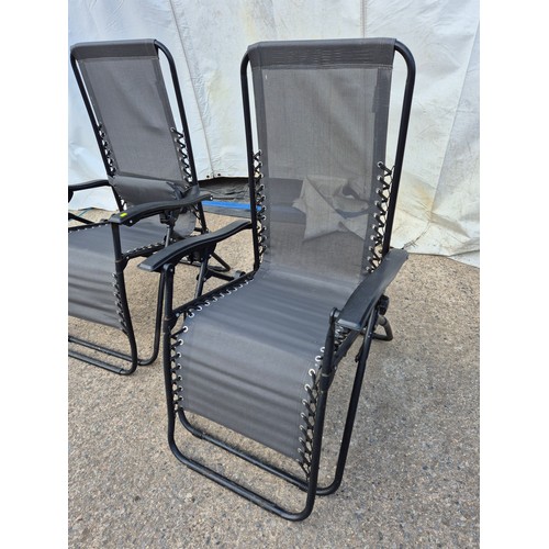 109 - A pair of metal framed collapsible garden chairs