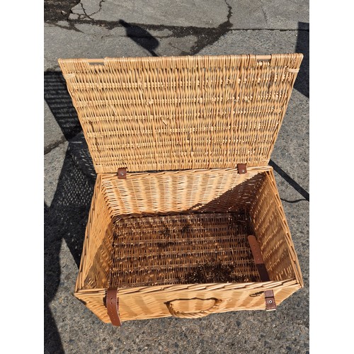 470 - A wicker basket with leather straps