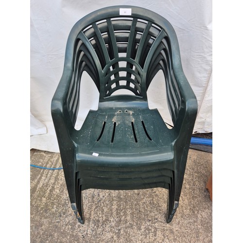 23 - A set of 4 plastic outdoor chairs