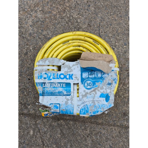 70 - An unused 50m roll of hozelock hose