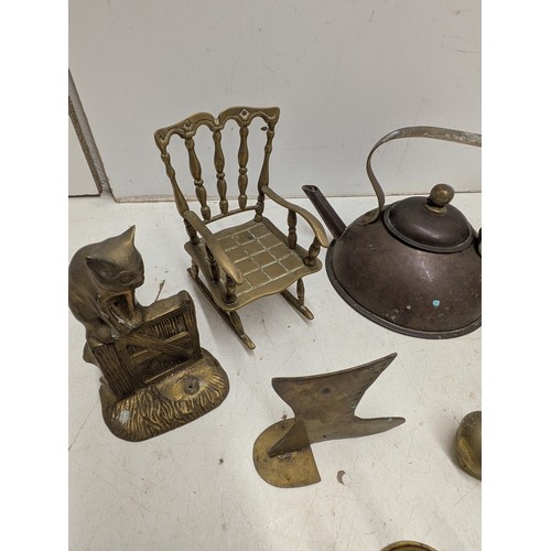 803 - A selection of brass ornaments including animals, and a copper kettle