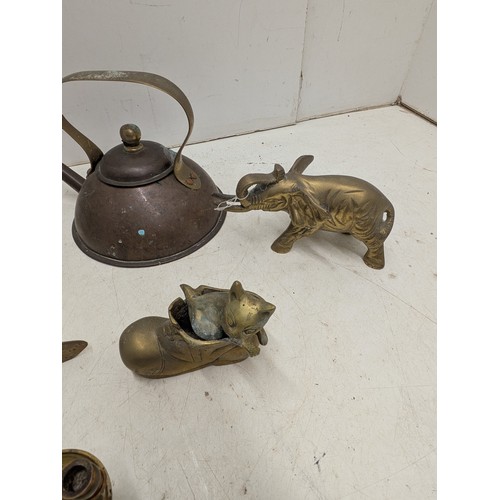 803 - A selection of brass ornaments including animals, and a copper kettle