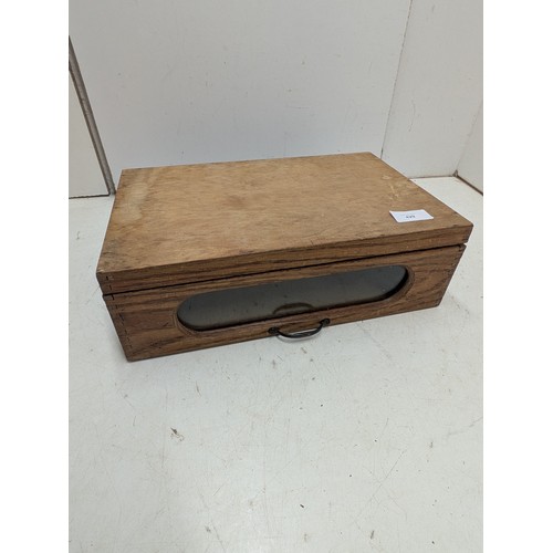 429 - A pine box with a glass viewing window and brass handle