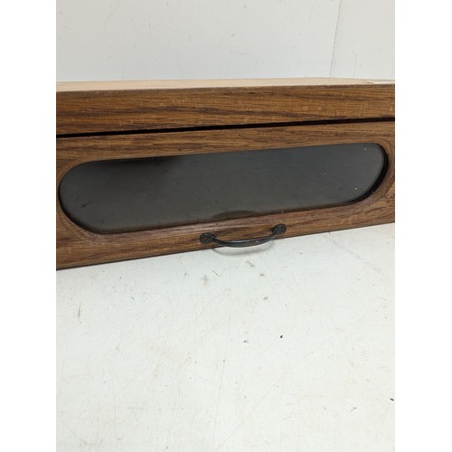 429 - A pine box with a glass viewing window and brass handle