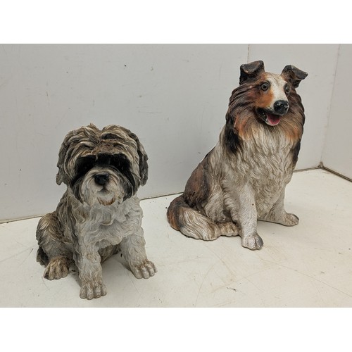 299 - A pair of resin dog statues