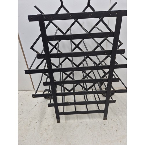 608 - A wrought iron, 21 bottle wine rack