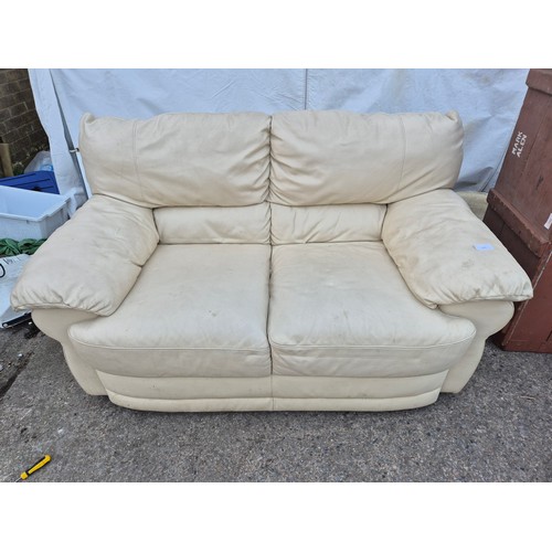 623 - A J H Hicolity leather sofa in cream.