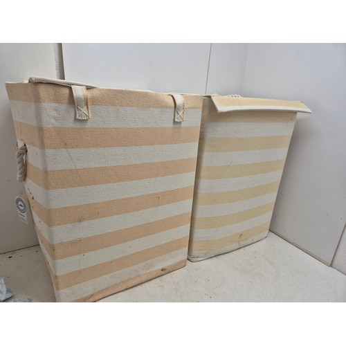 634 - Two yellow and white striped laundry hampers