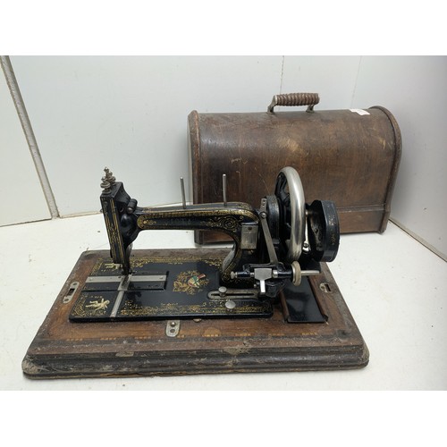 1015 - Antique Victa hand crank sewing machine in a wooden case