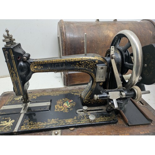 1015 - Antique Victa hand crank sewing machine in a wooden case