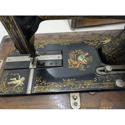 1015 - Antique Victa hand crank sewing machine in a wooden case