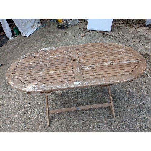 126 - A pine garden table