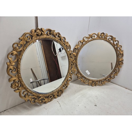 462 - A pair of circle Bevelled edge wall mirrors with ornate Gold Gilt frames