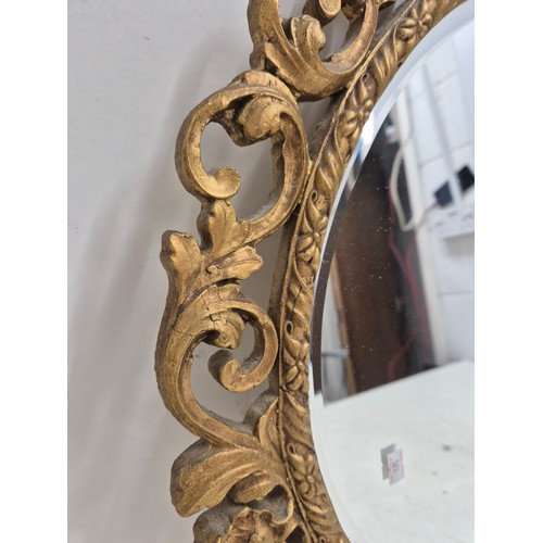 462 - A pair of circle Bevelled edge wall mirrors with ornate Gold Gilt frames