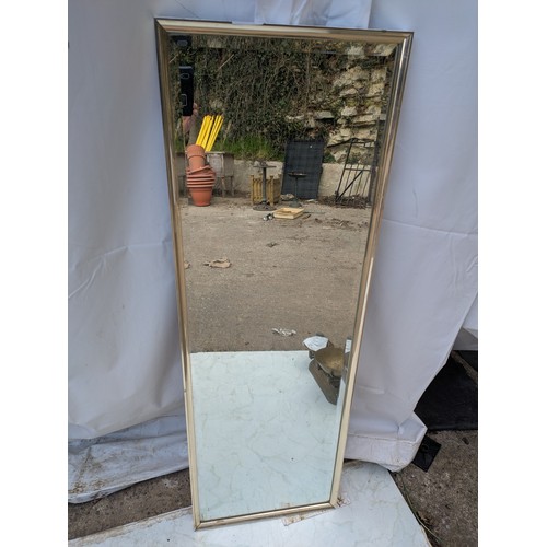 442 - An upright Bevelled edge mirror in a chrome frame