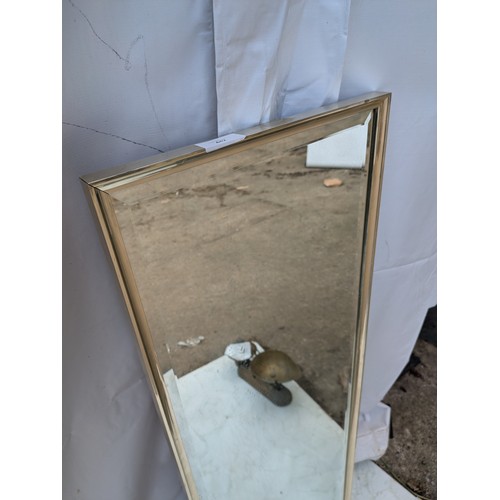 442 - An upright Bevelled edge mirror in a chrome frame