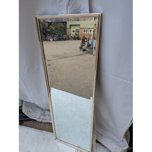 442 - An upright Bevelled edge mirror in a chrome frame