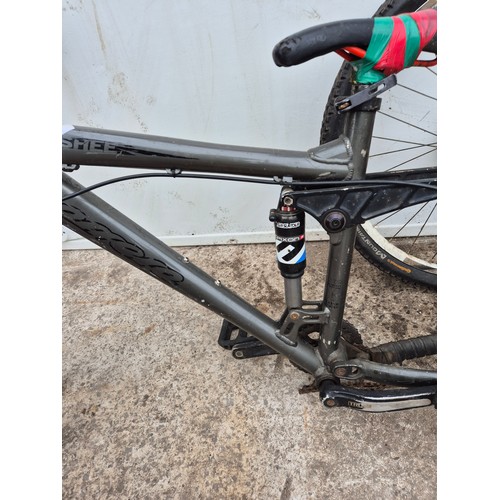 241 - A banshee mountain bike frame with one Continental wheel