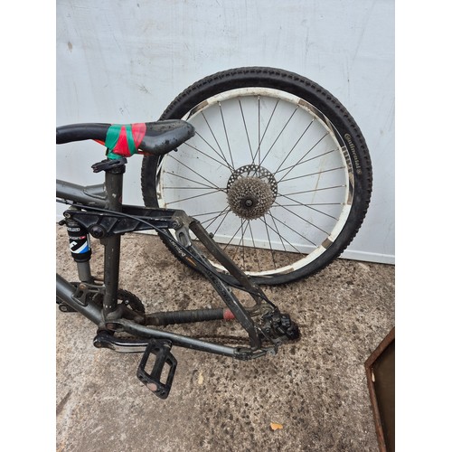 241 - A banshee mountain bike frame with one Continental wheel