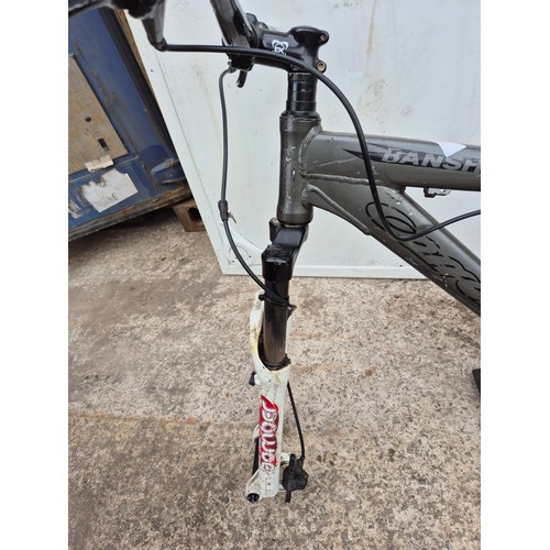 241 - A banshee mountain bike frame with one Continental wheel
