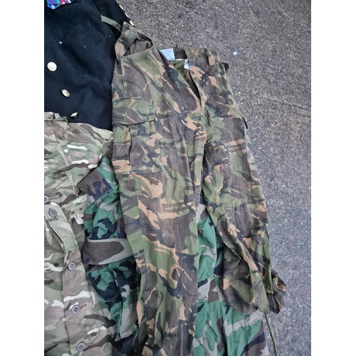 2146 - A Selection of military clothing including camo coats, trousers and a dress jacket
