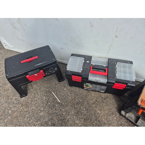 A selection of tools boxes including a black and Decker workmate ...