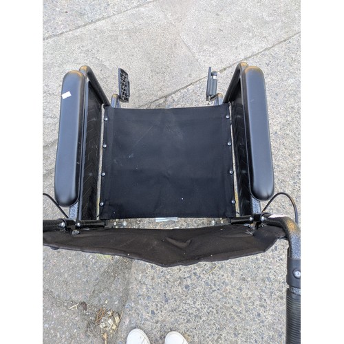210 - A collapsible wheelchair
