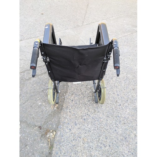 210 - A collapsible wheelchair