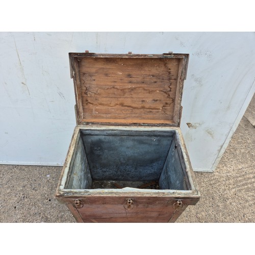 14 - A tall storage chest with metal latches and reinforcements