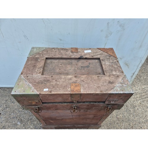 14 - A tall storage chest with metal latches and reinforcements