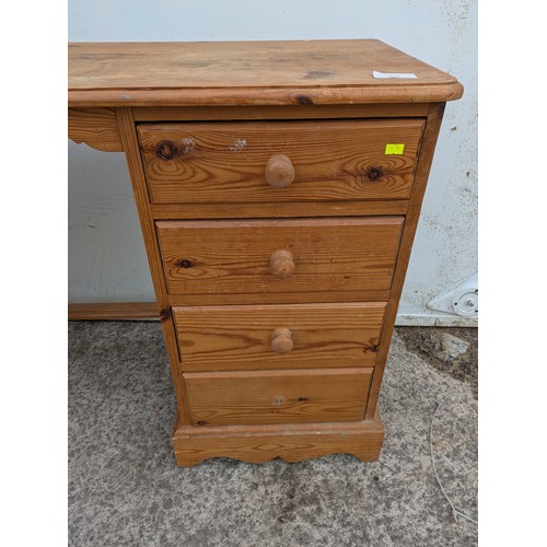 654 - A pine desk with 8 drawers